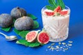 Glass of yogurt with fig fruit slices. Royalty Free Stock Photo
