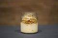 Glass of yogurt with granola and banana