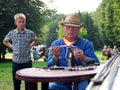 Glassblower making a craft outdoors