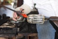 Glassblower shaping molten glass Royalty Free Stock Photo