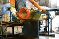 Glassblower shaping a vase