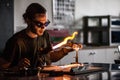 Glassblowing Young Man Working on a Torch Flame with Glass Tubes