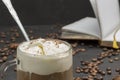 Glasse coffee, drink mix of cold coffee and ice cream. Coffee beans and notebook