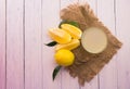 Glasse with freshly squeezed lemon juice on a white wooden background. Top view. Copy space.