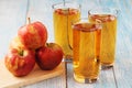 Glasses with apple juice and ripe apples Royalty Free Stock Photo