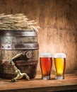 Glasses of beer and ale barrel on the wooden table. Craft brewe Royalty Free Stock Photo