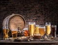 Glasses of beer and ale barrel on the wooden table. Craft brewery Royalty Free Stock Photo