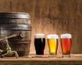 Glasses of beer and ale barrel on the wooden table. Royalty Free Stock Photo