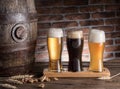 Glasses of beer and ale barrel on the wooden table. Craft brewery Royalty Free Stock Photo