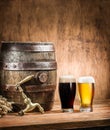 Glasses of  beer and ale barrel on the wooden table. Craft brewery Royalty Free Stock Photo