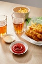 Of beer, chicken nuggets with french