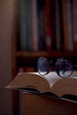 The glasses and the big books