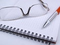 Glasses on blocknote one Royalty Free Stock Photo