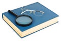 Glasses on a blue book Royalty Free Stock Photo