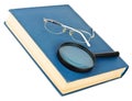Glasses on a blue book Royalty Free Stock Photo