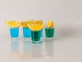 Glasses with blue and green kamikaze, glamorous drink, mixed drink poured into shot glasses Royalty Free Stock Photo