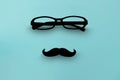 glasses on blue isolated background with Moustaches Royalty Free Stock Photo