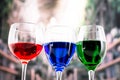 Glasses with blue red and green liquid cocktails Royalty Free Stock Photo