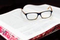 Glasses on the book of Talmud. Background Torah study