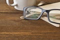 Glasses and book on wood Royalty Free Stock Photo