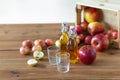 Glasses and bottles of apple juice on wooden table Royalty Free Stock Photo