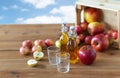 Glasses and bottles of apple juice on wooden table Royalty Free Stock Photo