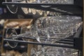 Glasses and bottles on a rack in the wine cellar Royalty Free Stock Photo