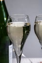 Glasses of bubble wine champagne, cremant, cava or prosecco and christmas stars for decoration Royalty Free Stock Photo