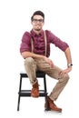 Glasses, chair and portrait of man in nerd fashion and suspenders isolated on transparent png background. Happiness