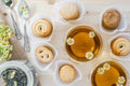 Glasses of Chamomile Tea and Cookies on a Wooden Kitchen Table, Close Up, Top View Royalty Free Stock Photo