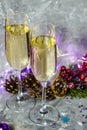 Glasses with champagne against the background of New Year`s decoration. Royalty Free Stock Photo