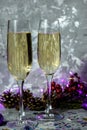 Glasses with champagne against the background of New Year`s decoration. Royalty Free Stock Photo