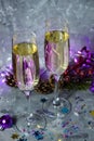 Glasses with champagne against the background of New Year`s decoration. Royalty Free Stock Photo