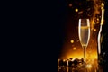 Glasses of champagne on a black background with copy space. Party or holiday concept. New Year or Christmas background Royalty Free Stock Photo