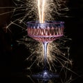 Glasses of champagne on blask background with sparklers. Royalty Free Stock Photo