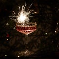 Glasses of champagne on blask background with sparklers. Royalty Free Stock Photo