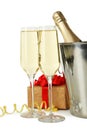 Glasses of champagne with bottle in a bucket on white background Royalty Free Stock Photo