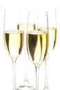Four full champagne glasses in front of white background Royalty Free Stock Photo