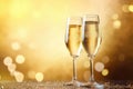 Glasses of champagne on a festive background, party or holiday concept. New Year or Christmas sparkling background. Gold Royalty Free Stock Photo