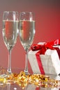 Glasses of champagne, gifts with red tapes