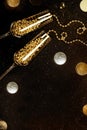 Glasses with champagne gold decor on black background. Christmas holiday concept Royalty Free Stock Photo