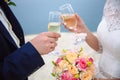 Glasses of champagne in the hands the bride and groom in the wedding day Royalty Free Stock Photo