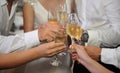 Glasses of champagne in the hands of guests at a wedding Royalty Free Stock Photo