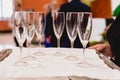 Glasses of champagne ready to be served by a waiter Royalty Free Stock Photo