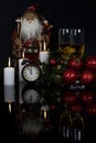 Glasses with champagne, Santa Claus and christmas decoration Royalty Free Stock Photo