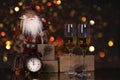 Glasses with champagne, Santa Claus and christmas gifts Royalty Free Stock Photo