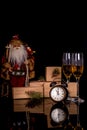 Glasses with champagne, Santa Claus and christmas gifts Royalty Free Stock Photo