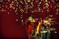 Glasses champagne sparklers golden lights. Happy New Year Royalty Free Stock Photo