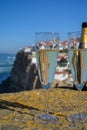 Glasses of champagne sparkling wine and view on white houses of picturesque village Azenhas do mar, Lisbon area, Portugal Royalty Free Stock Photo