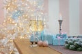 Glasses of champagne surrounded by luxury Christmas New year background and decoration, light bokeh effect Royalty Free Stock Photo